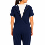 Close-up of open diagonal back zipper on navy adaptive jumpsuit for easy dressing