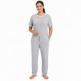 Women's adaptive jumpsuit front view with threaded round neck, front zip, back zip and soft breathable fabric