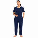 Woman wearing navy adaptive anti-strip jumpsuit for dementia and Alzheimer's care
